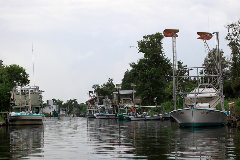 A tight waterway lined with shrimping boats. Photo by Erika Blumenfeld.