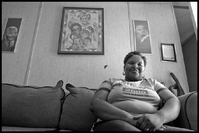 Vanessa McCloud, a worker at the Smithfield pork plant in Tar Heel, North Carolina. On the wall behind her are portraits of Nelson Mandela and Malcolm X.