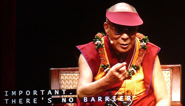 The image of the Dalai Lama projected on a large screen at the University of Hawaii where he spoke to students about peace, dialogue and secular ethics as part of the Pillars of Peace Hawaii initiative. (Photo: Jon Letman)