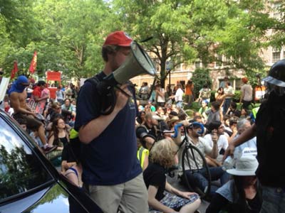 Protesters sitting in street in front of the house of Mayor Rahm Emanuel