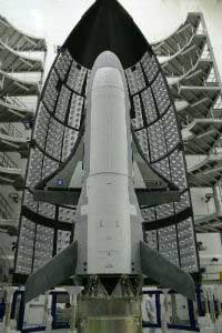 At the dawn of space warfare, the first X-37B Orbital Test Vehicle waits for launch in the encapsulation cell of the Evolved Expendable Launch vehicle at Titusville, Florida, April 5, 2010. (Image: U.S. Air Force)