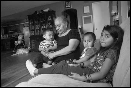 Lucrecia Camacho and three of her grandchildren Timoteo, Aron and Genesis. (Photo: David Bacon)