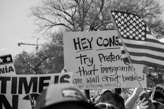 A contender for best sign: Hey Congress: try pretending that immigrants are Wall Street banks! (The rest will come naturally)!