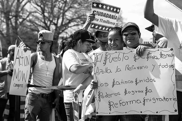 A couple poses to display their sign: The people of Guatemala support reform!