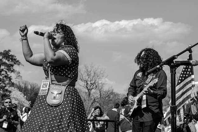 La Santa Cecilia perform one of their new songs El Hielo (ICE) to pump up supporters.