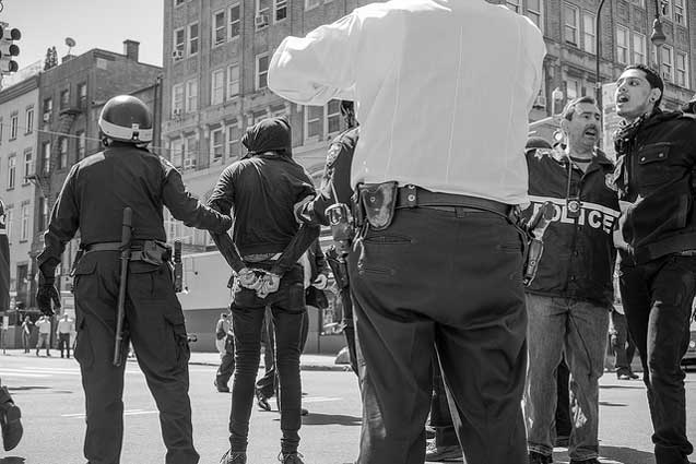Police detain arrested protesters in the busy streets of the East Village. (Photo: Craig O'Connor)