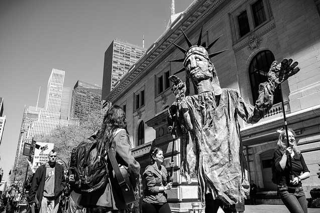 Lady Liberty passes the New York Public Library. (Photo: Craig O'Connor)
