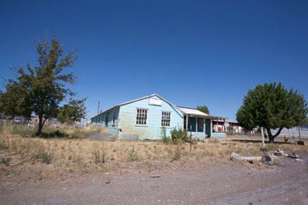 Houses like this on the old internment camp land were originally barracks for internees. (Photo: David Bacon).
