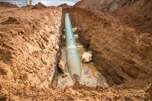 Douglas, Texas, February 19, 2103 Keystone XL pipeline being installed on Mike Bishop's property. Foam is seen floating in the ditch. Had the foam been supporting the pipe properly, rain would not have washed it out. One can only hope Michels supported the pipe properly before backfilling the ditch. (Photo: ©2013 Julie Dermansky)