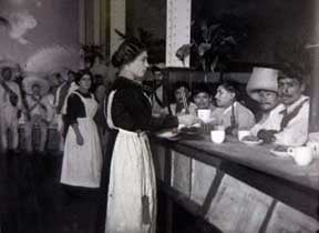 Peasant Zapatistas, members of a Mexican insurgent group, are fed breakfast at the famous restaurant Sanborns, Agustin Casasola, Mexico City, 1914.
