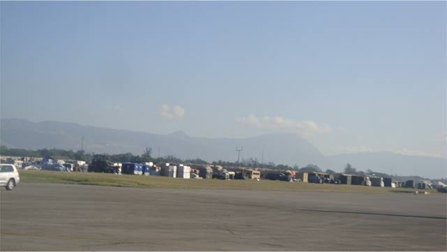 When Hagopian and his family reached the airport on the 5th day after the earthquake, they witnessed many plane loads of aid pile up on the tarmac - not distributed to Haitians who desperately needed water to survive. (Photo: Jesse Hagopian)