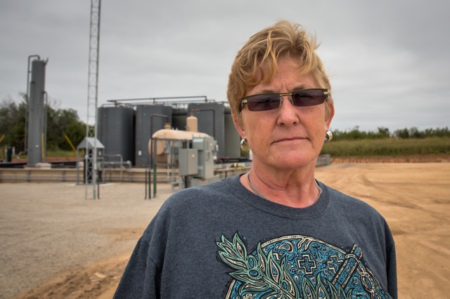 Anti-fracking Oklahoma activist Angela Spotts at a fracking industry site near her home on the outskirts of Stillwater, Oklahoma  (Photo: ©2014 Julie Dermansky)