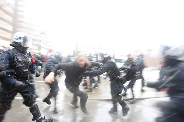 SPVM police forcefully eject a student from thousands-deep march on the first day of the strike. (Photo: Jonathan Leavitt)