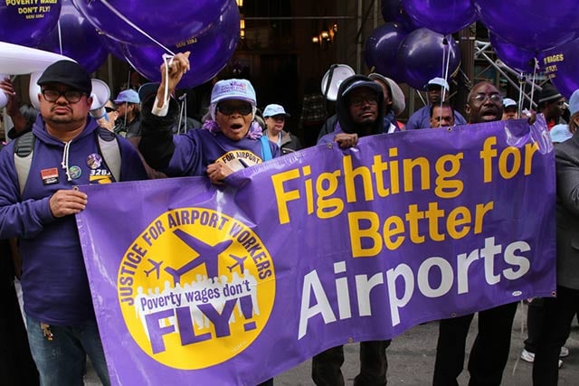 Airport workers and 32BJ SEIU members rally across the street from the New York offices of British Airways on April 23, 2015, in Manhattan. (Photo: Matt Surrusco / Truthout)