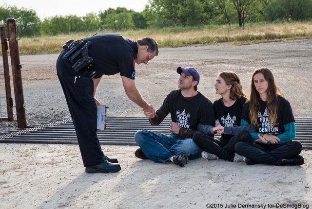 June 1, 2015, Sergeant Jenkins thanks Adam Briggle for his service to the community before arresting him and two other members of the Denton Drilling Awareness Group, Tara Linn Hunter and Niki Chochrek,  for criminal trespass. (Photo: Julie Dermansky)