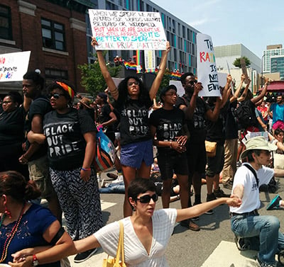 Non-black allies form a supportive circle around the event's Black organizers. (Photo: Kelly Hayes)