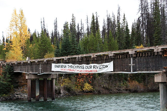 Visitors are stopped at this bridge over the Wedzin Kwah (Morice River) before entering the Unist’ot’en territory. (Photo: Courtesy of Tony Manno)