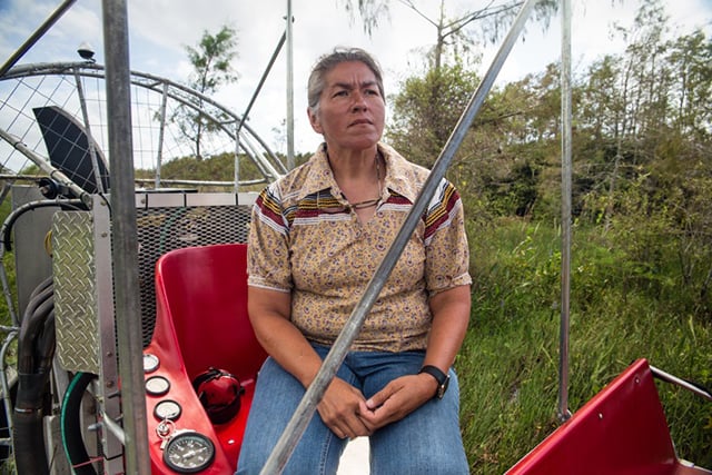 Betty Osceola on an airboat in the Everglades. (Photo: Julie Dermansky)