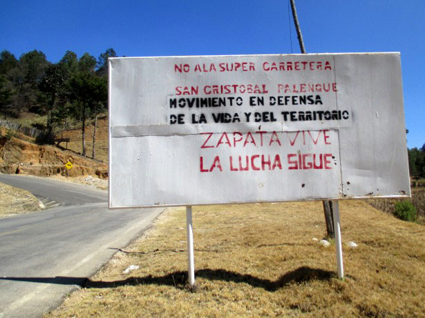 A sign along the road leading to Candelaria informs passers-by of opposition to the planned super-highway. (Photo: WNV / Sandra Cuffe)