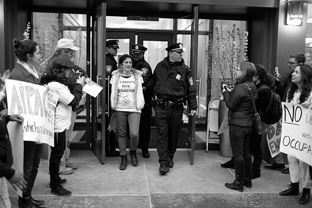 IfNotNow member is arrested for chaining herself to table inside AIPAC lobby. (Photo: Sam Boaz)