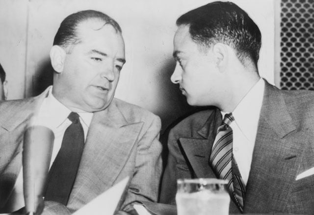 Sen. Joseph McCarthy chats with his attorney Roy Cohn during Senate Subcommittee hearings in 1954. Cohn was Donald Trump's longtime lawyer and mentor. 