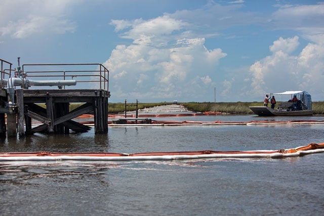 Airboat and boom used in the Hilcorp oil spill cleanup effort. (Photo: Julie Dermansky)