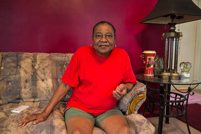 Patricia Lange in her living room. Lange wants to move because she says the mercaptan in the air is making her sick but can't because she is unable to sell or rent her home due to the horrible odors. (Photo: Julie Dermansky)