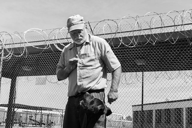 2. William Johanson trains a dog in the yard at Rayburn Correctional Center in Angie, Louisiana. After receiving complaints from another prisoner in the mid-1990s, federal officials sued the Louisiana state prison system on behalf of Johanson to bring facilities with deaf prisoners into compliance with the Americans with Disabilities Act. (Photo: Annie Flanagan)