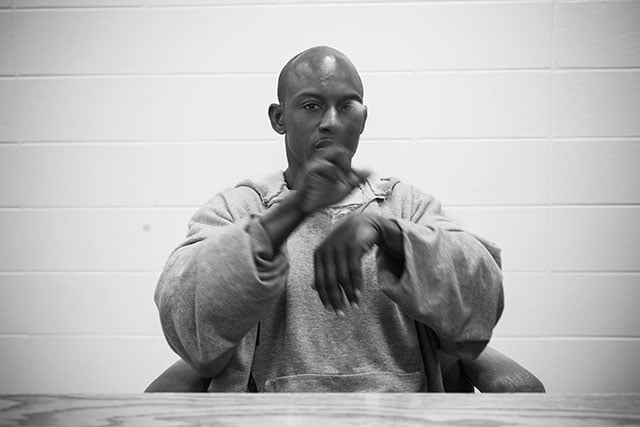 5. Emmanuel Steward signs during an interview at Rayburn Correctional Center. (Photo: Annie Flanagan)