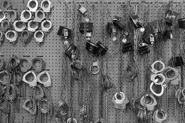 7. Handcuffs hang in the front office of the Rayburn Correctional Center. (Photo: Annie Flanagan)