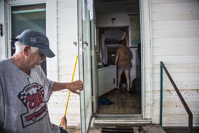 The Landaiches return to their home in Sorrento, Louisiana, on March 20, 2016 to try to rescue what they can after floodwaters inundated their home. (Photo: Julie Dermansky)
