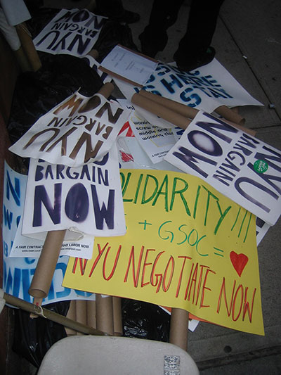 Picket signs lie in a heap after a graduate student worker picket at NYU on November 10, 2005. (Photo: Tracy Neumann)