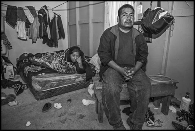 Felimon Piñeda and his wife in their room in the labor camp at Sakuma Farms, during the strike in 2013. (Photo: David Bacon)