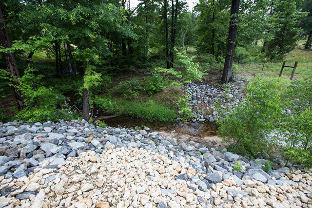Rocks lining the banks of a creek on Fairchild's land that the Gulf Coat pipeline crosses. (Photo: ©2016 Julie Dermansky) 