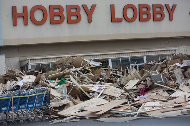 Debris piled in front of a gutted Hobby Lobby store on O’Neal Lane in Baton Rouge on September 9. (Photo: Julie Dermansky)