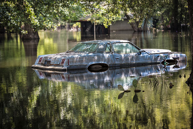 Car in front of flooded home off Ridge Road in Ascension Parish, Louisiana, on September 2. (Photo: Julie Dermansky)