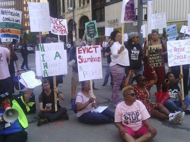 Protesters in downtown Pittsburgh, PA, block traffic on September 20, 2016, the day before a scheduled City Council hearing on an affordable housing fund proposal. (Photo: Molly Nichols)