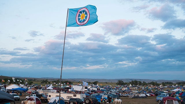 A Standing Rock Sioux flag flies over a protest encampment near Cannon Ball, North Dakota, where members of the Standing Rock nations and their supporters have gathered to voice their opposition to the Dakota Access Pipeline. (Photo by Robyn Beck / AFP / Getty Images)