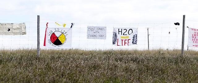 A sign along the highway near the Dakota Access Pipeline construction site reads 