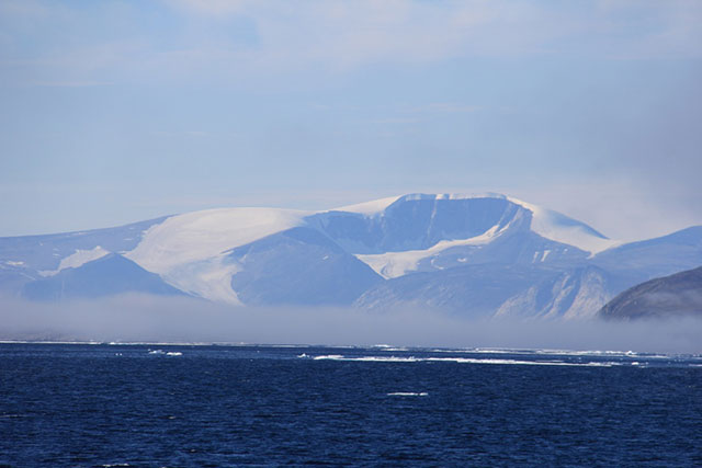 The bay to enter Clyde River is ringed by imposing, glacier-capped mountains. (Photo: Chris Williams)