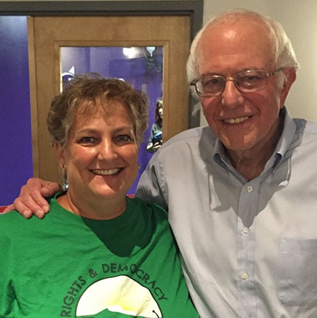 Vermont political candidate Mari Cordes stands with Bernie Sanders. 