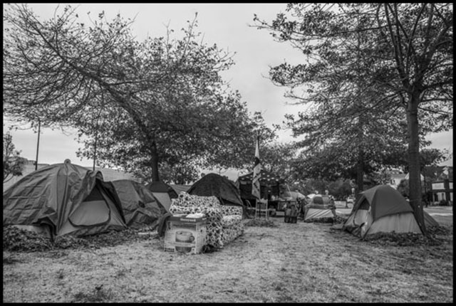 The occupation on the grass median in the middle of Adeline Street. (Photo: Davif Bacon)