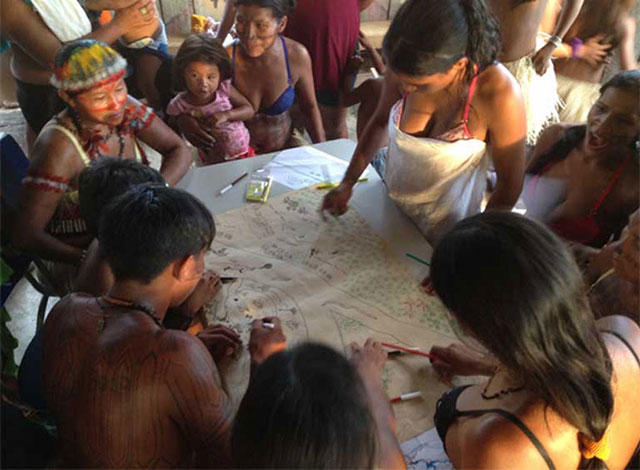 Indigenous Munduruku living on the Teles Pires River taking part in a mapping workshop. Indigenous people and river communities have seen, and will continue to see, territory lost, fisheries disrupted and depleted, and food security diminished, with the construction of the Tapajós Complex dams. (Photo by International Rivers on Flickr, licensed under an Attribution-NonCommercial-ShareAlike 2.0 Generic (CC BY-NC-SA 2.0) license)