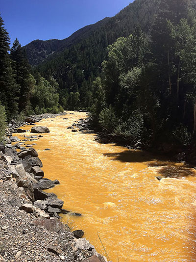 The waters of the Animas River, a tributary of the San Juan River, ran orange within 24 hours of the spill in southwestern Colorado. (Photo: Riverhugger)