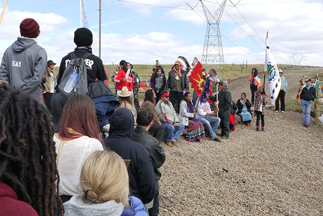 People take part in a speak out beside the construction road during halted construction on the Dakota Access Pipeline at Standing Rock in September 2016. (Photo: Sarah Jaffe) 