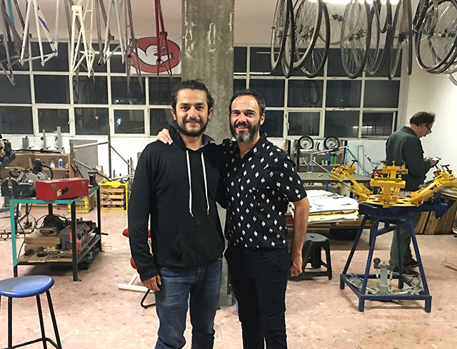 Founder Jésus López of ATEA (Arte Taller Estudio Arquitectura/Art and Architecture Workshop) in Mexico City shows the project’s bicycle workshop to Javier Esquillor, member and co-Founder of VIC (Vivero de Iniciativas Ciudadanas/Nursery of Citizen’s Initiatives) of Madrid. (Photo: Michael Meurer)