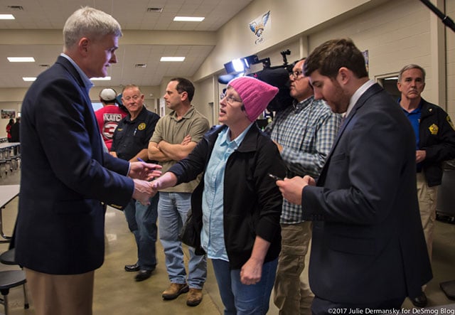 Sen. Cassidy talking to a worried constituent after the meeting who thanked him for taking questions from those who oppose his views. (Photo: Julie Dermansky)