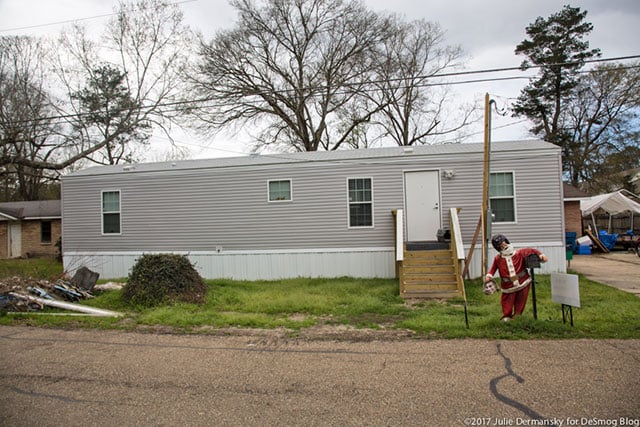 In Denham Springs, Louisiana, on Feb. 21, 2017, a FEMA trailer sits in front of a home that has not been restored since the 1,000 year flood the previous August. (Photo: Julie Dermansky)