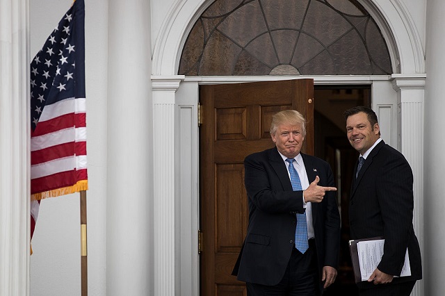President Donald Trump and Kris Kobach, vice chair for the Presidential Advisory Commission on Election Integrity. The commission has asked all 50 states for copies of their voter records, which often include names, addresses and ages. The commission has said it intends to make the information widely available. (Photo by Drew Angerer / Getty Images)