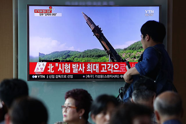 People watch a North Korea's KRT television show a photo of North Korea's test-launched first intercontinental ballistic missile released by Korean Central News Agency (KCNA) at the Seoul Railway Station on July 4, 2017 in Seoul, South Korea. North Korea fired an unidentified ballistic missile on Tuesday from a location near the North's border with China into waters at Japan's exclusive economic zone, east of the Korean Peninsula, according to reports. (Photo: Chung Sung-Jun / Getty Images)
